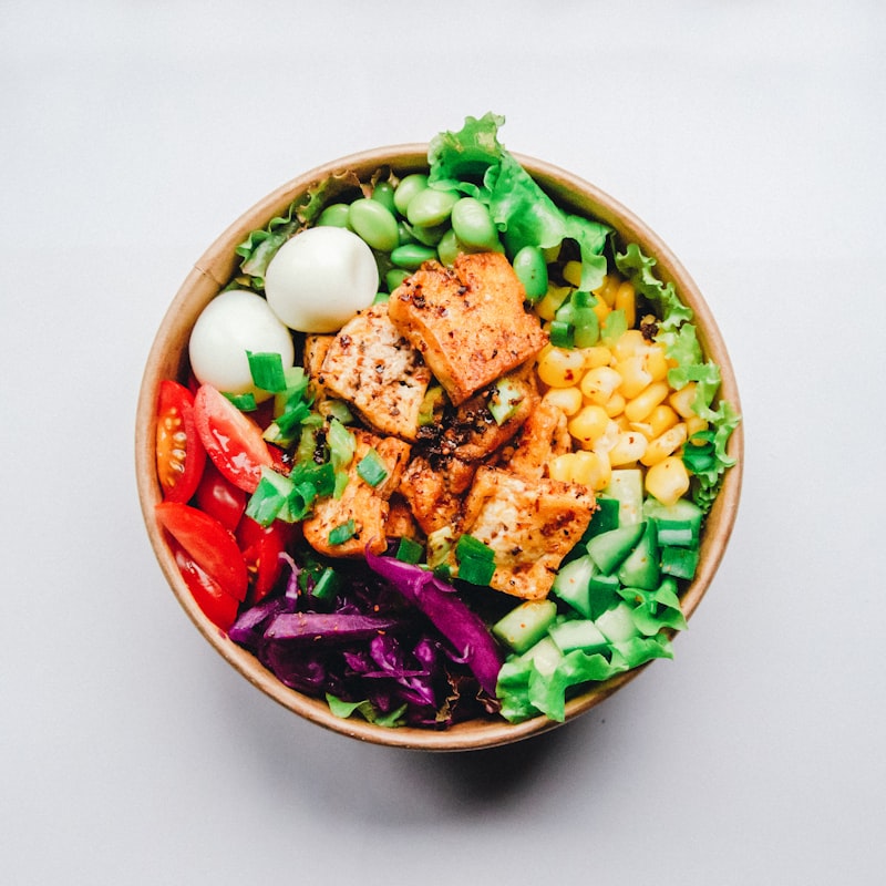 A keto-friendly salad plate with avocado and healthy fats